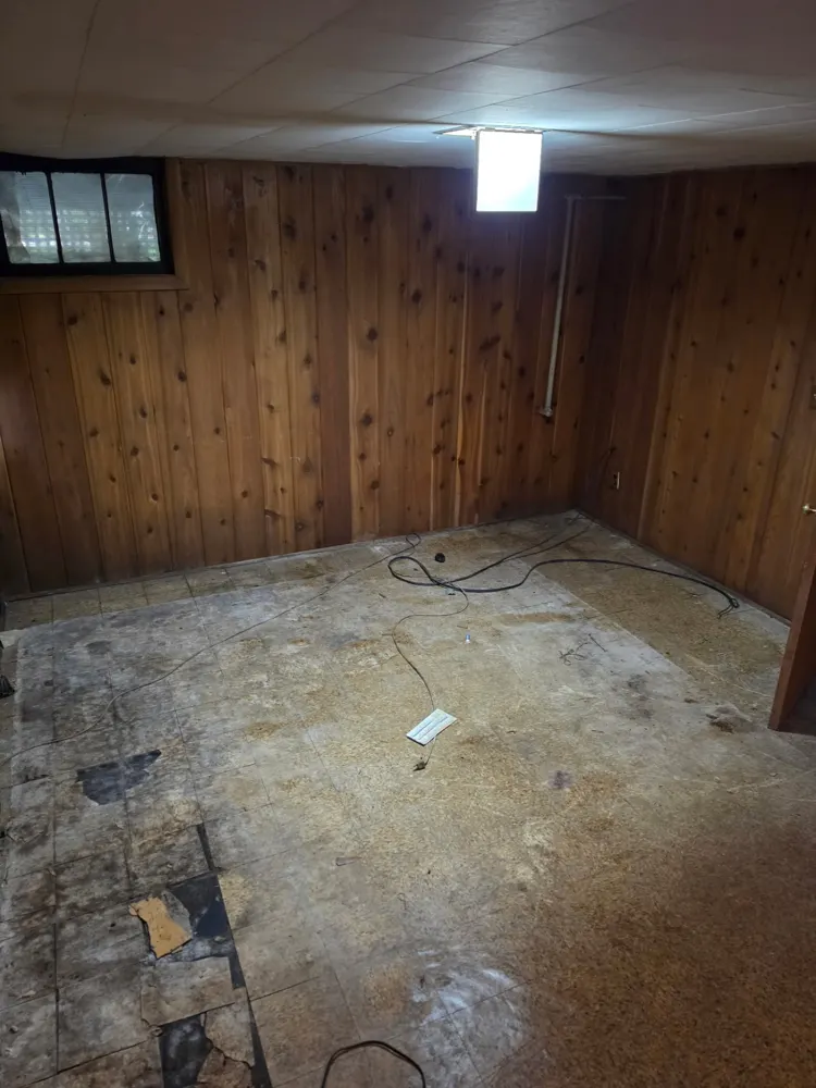After: paneled basement room cleared — Pioneer Valley Junk Removal job