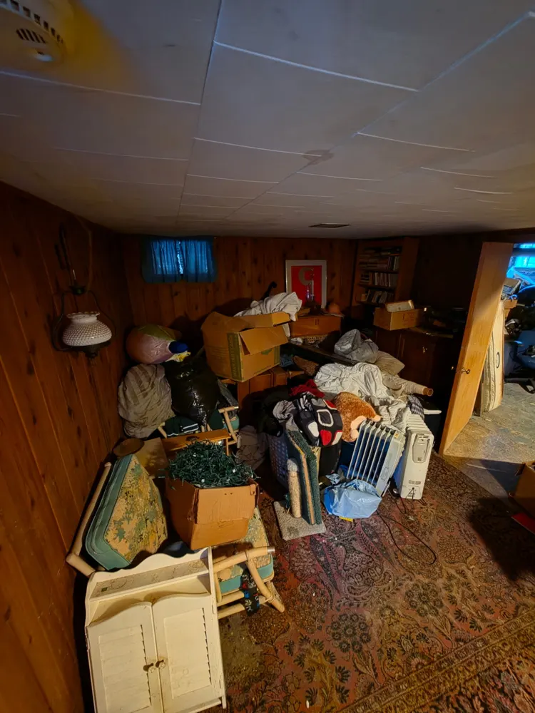 Before: paneled basement room cleared — Pioneer Valley Junk Removal job