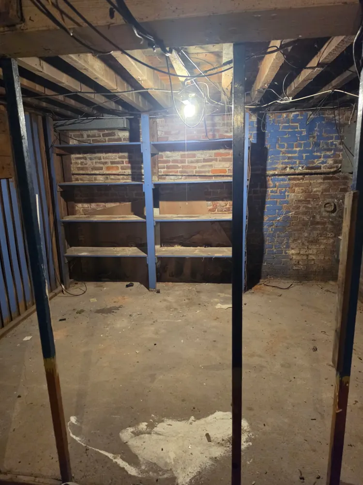 After: basement shelves and floor cleared — Pioneer Valley Junk Removal job