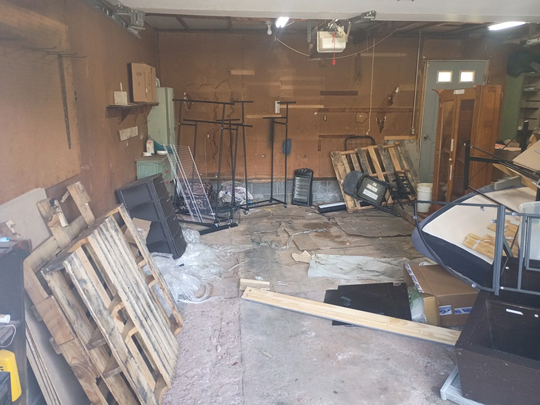 A packed garage before a Pioneer Valley Junk Removal cleanout