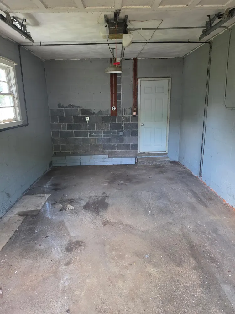 After: garage packed with scrap lumber, cleared — Pioneer Valley Junk Removal job